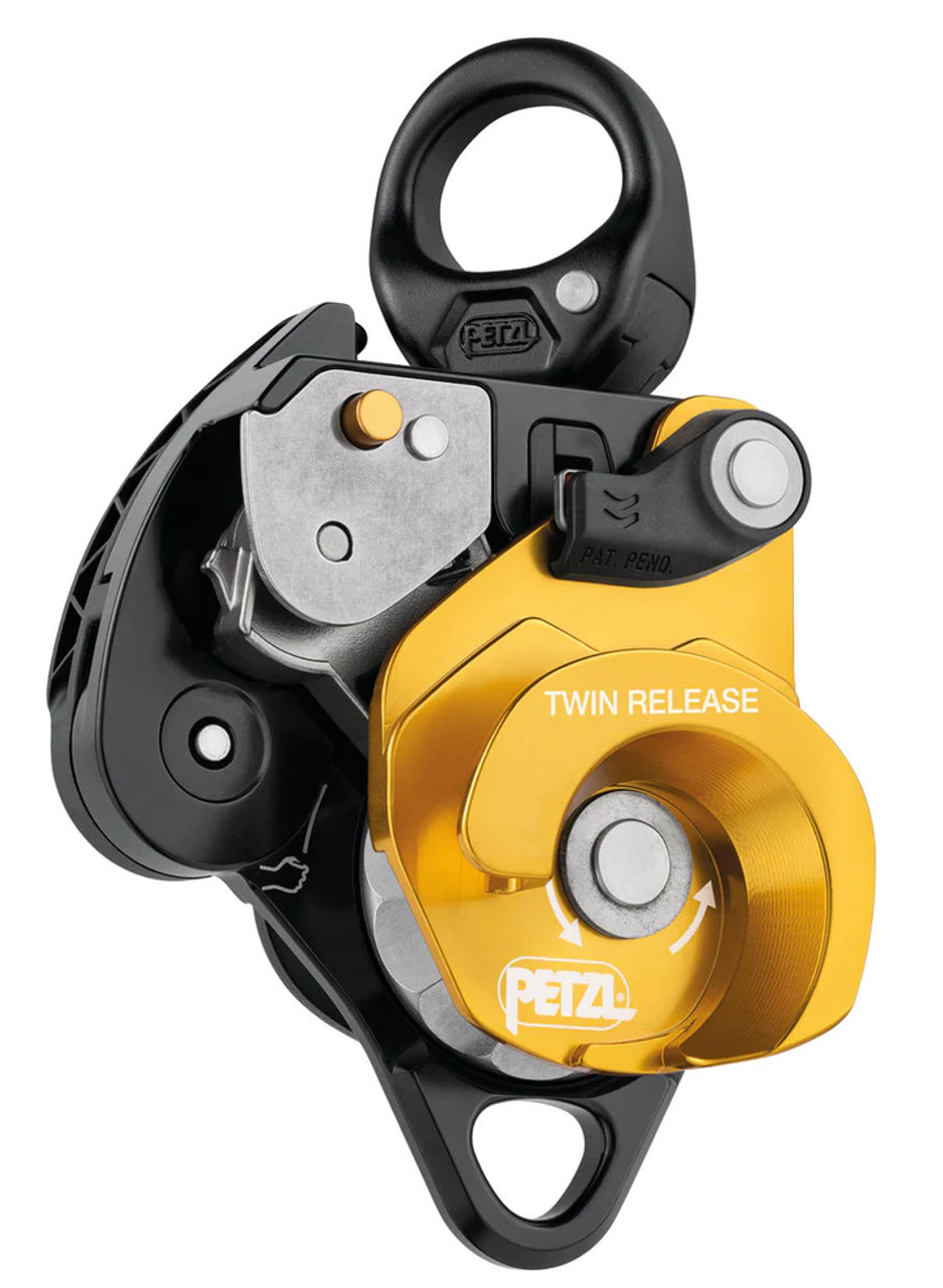 Releasable, the TWIN RELEASE progress capture pulley is designed to set up 4:1 haul systems for work in confined spaces or for technical rescue. Releasing the cam is possible with the ergonomic handle. The brake integrated into the moving side plate and the main faceted sheave with single-direction rotation, offer additional braking and better control when lowering heavy loads. The two sheaves provide excellent hauling efficiency. The swivel facilitates operations, allowing the pulley to be oriented under load and direct connection of carabiners, ropes, or slings.


SPECIFICATIONS
Weight: 800 g
Material(s): Aluminum, stainless steel, nylon
Certification(s): CE EN 567, CE EN 12278 partial*, NFPA 2500 Pulley General Use, NFPA 2500 Rope Grab Technical Use, UKCA * Meets performance requirements of the EN 12278 standard
System Certification(s): ANSI Z359.4 Synthetic Rope Tackle Block (more information in the Instructions for Use)
Min. rope diameter: 8 mm
Max. rope diameter: 13 mm
Sheave type: Sealed ball bearings
Faceted Sheave Diameter: 40 mm
Sheave diameter: 38 mm
Efficiency: 95 %
Maximum Working Load: 280 kg (more information in the Instructions for Use and in the technical tips at www.petzl.com)
Breaking strength of the auxiliary attachment point: 22 kN
Breaking strength: 36 kN