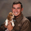 Gavin with his beagle pup in his brown lightweight Mule Brand Gear and Apparel jacket