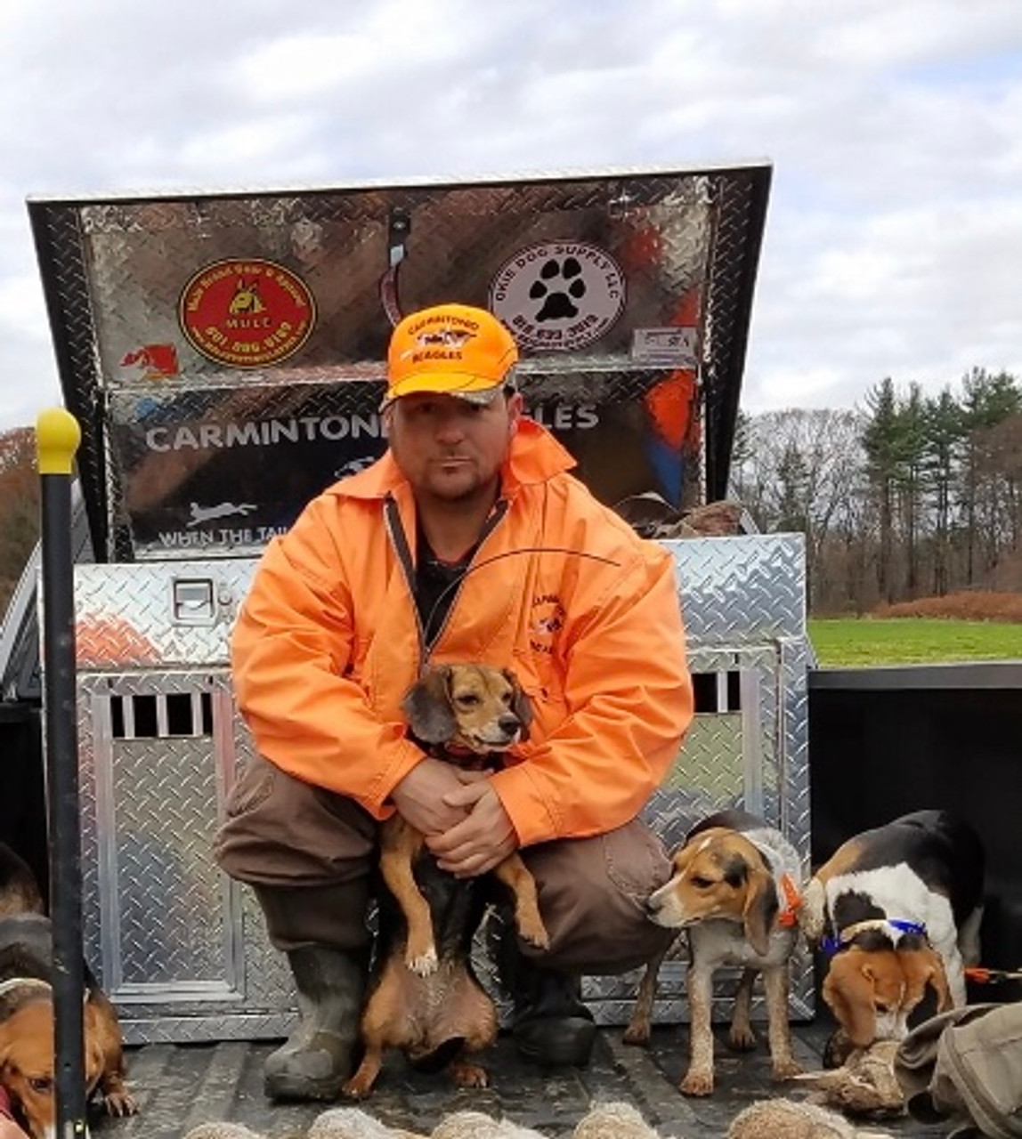 customer decorating his dog box with mule and okie dog decals