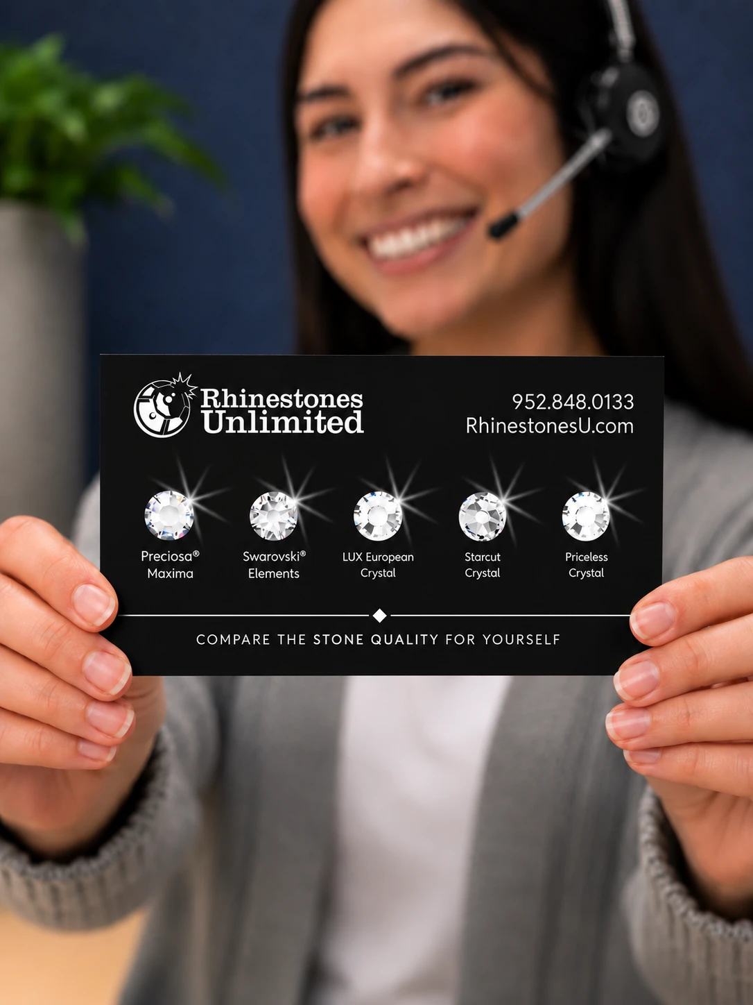 Rhinestones Unlimited team member holding a Brand Comparison Card with five crystal brand samples