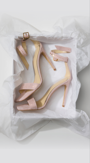 Pair of crystal-embellished heels in packaging