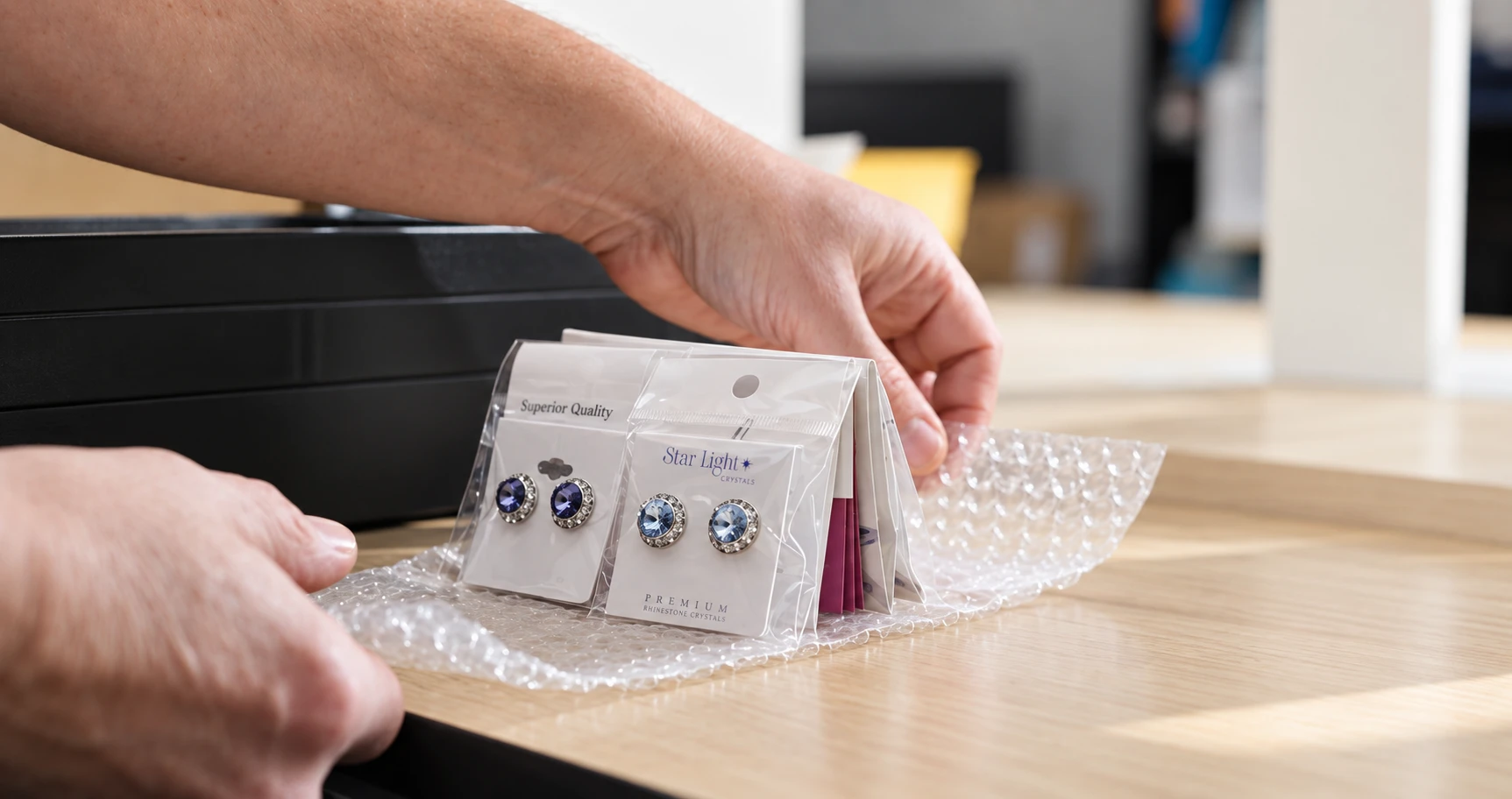 Rhinestones Unlimited carefully packaging a customer order
