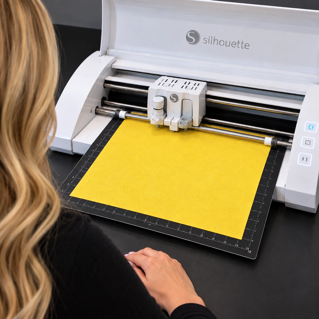 Silhouette cutting yellow rhinestone template flock on a cutting mat