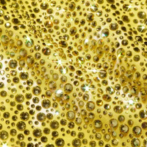Gold and yellow rhinestones in Preciosa's Acid Yellow color densely set on fabric