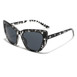 Cat eye sunglasses featuring a striking black and white tortoise print design by Infinite Haze.