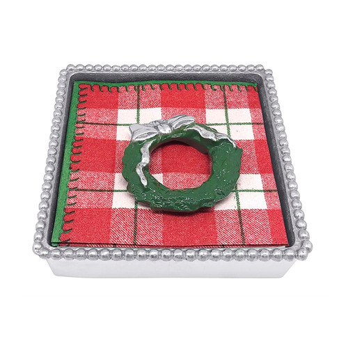 Mariposa Green Wreath Napkin Box 

1589C
5.75in L x 5.75in W x 1.5in H

Bring holiday cheer to your next gathering with our Green Wreath Beaded Napkin Box. This set includes a napkin box, stack of festive cocktail napkins and a decorative Green Wreath Napkin Weight. Handcrafted from 100% recycled aluminum
Recycled Sandcast Aluminum
