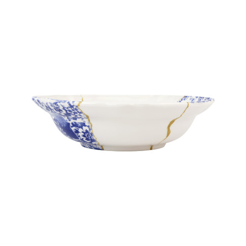 Vietri Storia Baroque Serving Bowl

SRA-9731
12.25 D, 3.25"H

Inspired by the poetic Japanese art of Kintsugi and brought to life by maestro Italian artisans, each Storia piece celebrates the beauty found in imperfection. The Storia Baroque Serving Bowl features handpainted blue and white designs with gilded seams, and it exudes both old-world charm and modern high design. Each piece demonstrates the strength and elegance in resilience and makes a striking statement piece on your table.