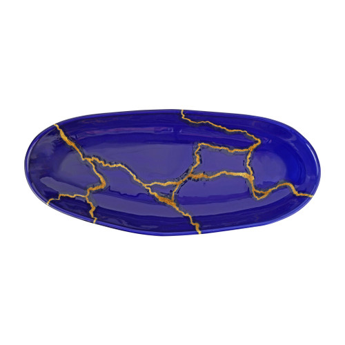 Vietri Storia Blue and Gold Oval Platter

SRA-9725
17.25"L, 7.5"W

Inspired by the poetic Japanese art of Kintsugi and brought to life by maestro Italian artisans, each Storia piece celebrates the beauty found in imperfection. The Storia Blue and Gold Round Platter features handpainted designs with gilded seams, and it exudes both old-world charm and modern high design. Each piece demonstrates the strength and elegance in resilience and makes a striking statement piece on your table.