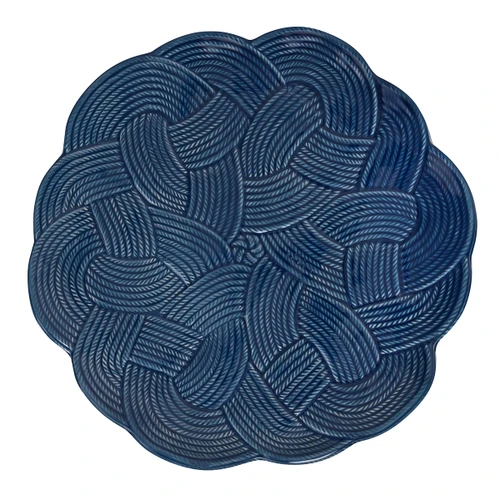Juliska Le Panier Mystic Knot Charger/Platter - Denim

KHM09/46
14"D

Symbolizing protection, love, and a long, happy life, the mystic knot has been cherished for generations by sailors as a tribute to their families and the sea. With its interwoven braided whorls in a deep denim blue hue, this large charger delivers rich textural warmth, a sculptural silhouette, and a timeless aesthetic to the table for layering with other patterns or for use as a beautiful serving platter.