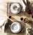Puro Whitewash 5pc Setting 

№ KS29X/10

From our Puro Collection - Everything you need to set a stylish place at your table - perfect for parties, and eminently useful for everyday. Five piece setting includes Dinner Plate, Dessert/Salad Plate, Side/Cocktail Plate, Cereal/Ice Cream Bowl. and Cofftea cup.

Measurements:
Dinner Plate: 11" W
Dessert/Salad Plate: 9" W
Side/Cocktail Plate: 7" W
Cereal/Ice Cream Bowl: 6.5" W x 2.75" H (15 ounces)
Cofftea Cup: 3.75" W x 3.75" H (14 ounces)
Made of Ceramic Stoneware
Oven, Microwave, Dishwasher, and Freezer Safe
Made in Portugal
