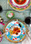 Vietri Campagna Mucca Olive Oil Bowl

MCA-1007
4"D

Part of Vietri's premiere dinnerware line from the famed Amalfi Coast, Mucca from plumpuddingkitchen.com offers endless possibilities for artistic entertaining when mixed with bright solids or the other colorful patterns of Campagna. Capture the vitality of the Italian countryside with this whimsical collection!

Translation: cow
Handmade of terra cotta in Campania by Solimene
Part of the Campagna Collection, VIETRI's very first dinnerware collection introduced in 1983!
Dishwasher and microwave safe