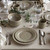 Juliska Puro Taupe 4pc Place Setting

KS40X/66

Everything you need to set a stylish place at your table - perfect for parties, and eminently useful for every day. Inspired by the Portuguese regard for objects found in their most natural and uncontrived state, Juliska created this simultaneously modern and timeless collection - simply beautiful by design, richly textural, and the perfect neutral canvas to serve up your every culinary adventure. Offered in a chic and delightful blush hue for a subtle pop of color, this four piece place setting from plumpuddingkitchen.com includes: dinner plate, dessert/salad plate, cereal/ice cream bowl and mug.