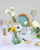 Vietri Nuovo Stripe Green Rectangular Vase

NUO-5482G
4.5"L, 2.5"W, 7.75"H

Nuovo Stripe from plumpuddingkitchen.com combines contemporary design with traditional style in a mouthblown barware assortment fit for elegant and casual dining alike.

Mouthblown of borosilicate glass in Veneto.

Dishwasher, microwave, freezer and oven safe.