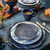 Juliska Le Panier Mystic Knot Charger/Platter - Denim

KHM09/46
14"D

Symbolizing protection, love, and a long, happy life, the mystic knot has been cherished for generations by sailors as a tribute to their families and the sea. With its interwoven braided whorls in a deep denim blue hue, this large charger delivers rich textural warmth, a sculptural silhouette, and a timeless aesthetic to the table for layering with other patterns or for use as a beautiful serving platter.