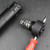 Total Innovative Tactical Solutions' Rugged Obsidian Suppressor Takedown Tool shown successfully disassembling the suppressor, with a basic philips screwdriver being used in tandem for extra leverage to take it apart.