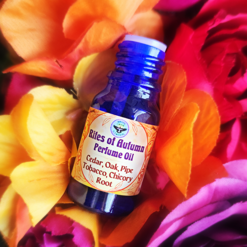 RITES OF AUTUMN Perfume Oil crafted by Ravyn Grove Elemental LLC, using Cedar & Oak Oils, Pipe Tobacco Fragrance Oil, Chicory Root, and Calendula Petals! Harness the energies of Autumn! front