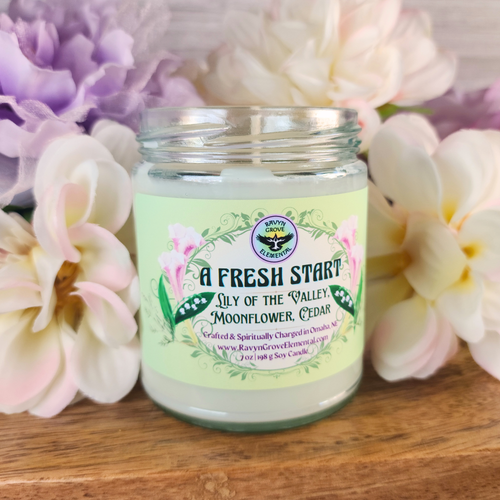 A FRESH START SOY CANDLE - Spiritually Charged and infused with our handcrafted special road opener blend of Lily of the Valley, Moonflower, & Cedar Oils!