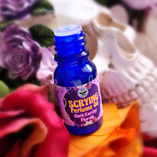Our SCRYING PERFUME OIL is Spiritually Charged and crafted to help you peer through the veil and gain insights therefrom; easing your abilities in divination, mediumship, and spirit communication. A Dark Earthy Floral Infusion.