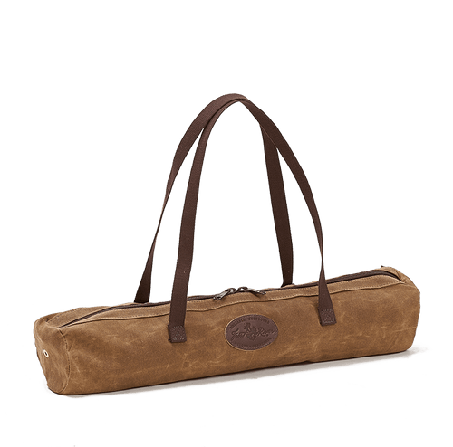 The Brewasana Yoga Mat Tote has long cotton shoulder straps and a large waxed canvas pocket that has a long zipper to make taking the mat out easy. 