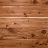 Reddish-brown cedar wood planks with knots — scent inspiration for Cedar fragrance oil