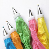 Five piping bags of colorful frosting tips — scent inspiration for Buttercream fragrance oil