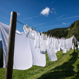 White laundry on a clothesline under blue sky — scent inspiration for Clean Cotton fragrance oil