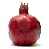 Whole red pomegranate on white background — scent inspiration for Pomegranate fragrance oil