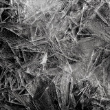 Jagged black-and-white ice crystals on a dark background — scent inspiration for Black Ice fragrance oil