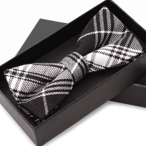 Black and white plaid bow tie in a gift box — scent inspiration for Burberry Brit fragrance oil