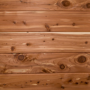 Reddish-brown cedar wood planks with knots — scent inspiration for Cedar fragrance oil