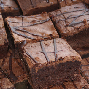 Stacked chocolate brownies drizzled with dark chocolate — scent inspiration for Fudge Brownie fragrance oil