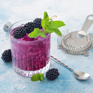 Purple cocktail with crushed ice, blackberries, and mint — scent inspiration for Blackberry Margarita fragrance oil