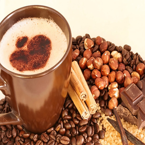 Tall mug of frothy coffee with beans, hazelnuts, cinnamon — scent inspiration for Cappuccino Brulee fragrance oil
