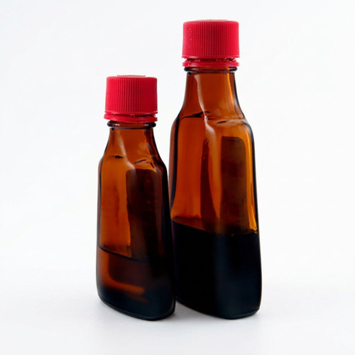 Two amber bottles with red caps holding dark liquid — scent inspiration for Vanilla Satin fragrance oil