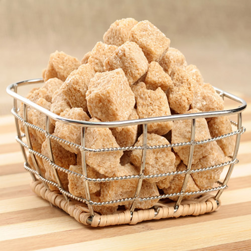 Brown sugar cubes in a wire basket on wood — scent inspiration for Brown Sugar fragrance oil