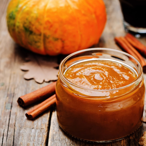Jar of orange-brown puree with a pumpkin and cinnamon sticks — scent inspiration for Apple Pumpkin Butter fragrance oil