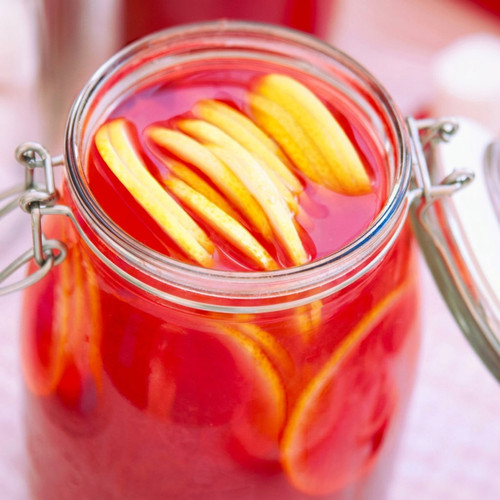 Glass jar of pink lemonade with lemon slices — scent inspiration for Watermelon Lemonade fragrance oil