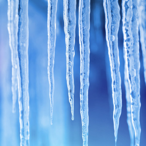 Blue-toned icicles against a blurred blue background — scent inspiration for Icicles fragrance oil
