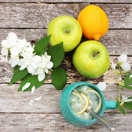 green apples, orange and white blossoms on weathered wood — scent inspiration for Jasmine & Green Apple fragrance oil