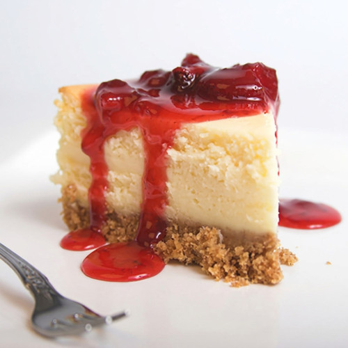 Cheesecake slice with red berry sauce dripping down — scent inspiration for Strawberry Cheesecake fragrance oil