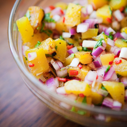 Glass bowl of diced pineapple, red onion, and herbs — scent inspiration for Pineapple Cilantro fragrance oil