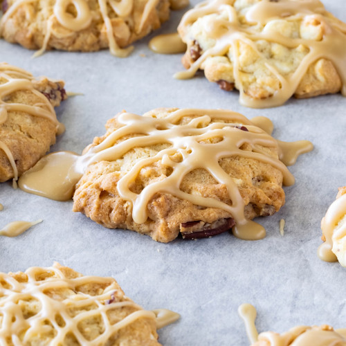 Glazed cookies with cranberries and pecans on parchment — scent inspiration for Oatmeal Maple Crunch fragrance oil