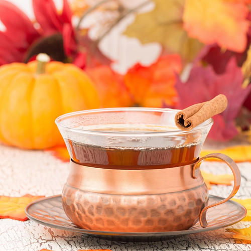 Spiced tea with cinnamon stick, pumpkin and fall leaves — scent inspiration for Pumpkin Chai fragrance oil