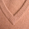 Close-up of a tan V-neck knit sweater — scent inspiration for Cashmere fragrance oil