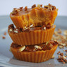 Stacked orange caramel cups topped with chopped nuts — scent inspiration for Pumpkin Caramel Delight fragrance oil