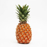 Whole pineapple with green crown on white — scent inspiration for Pineapple fragrance oil