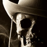 Human skull wearing a hat against a dark smoky background — scent inspiration for Desperado fragrance oil