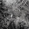 Jagged black-and-white ice crystals on a dark background — scent inspiration for Black Ice fragrance oil