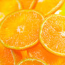 Close-up of juicy orange slices stacked together — scent inspiration for Mango Mandarin fragrance oil