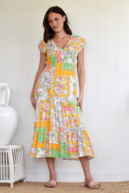 SANCTUM AUSTRAL DRESS
V neck with tie
Cap sleeve 
Elastic waist
Wide layered skirt
100% rayon